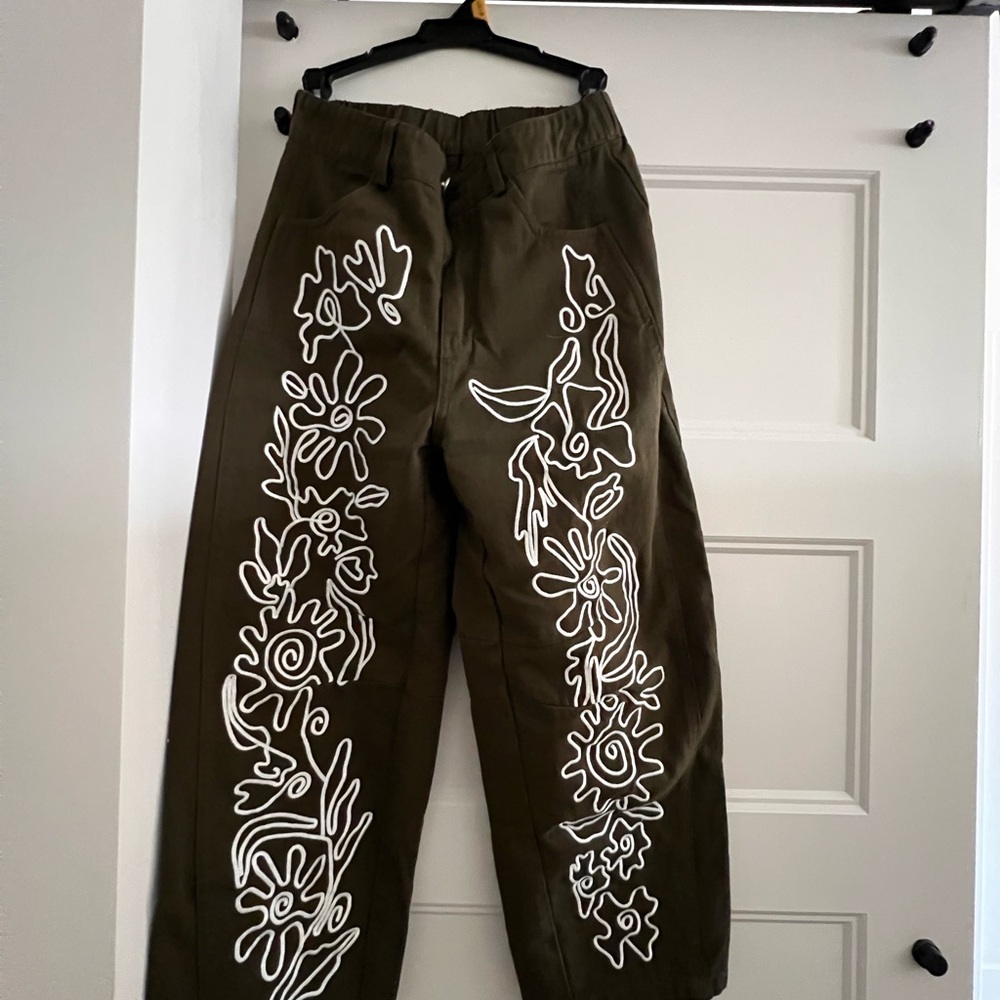 Dark olive green trousers
